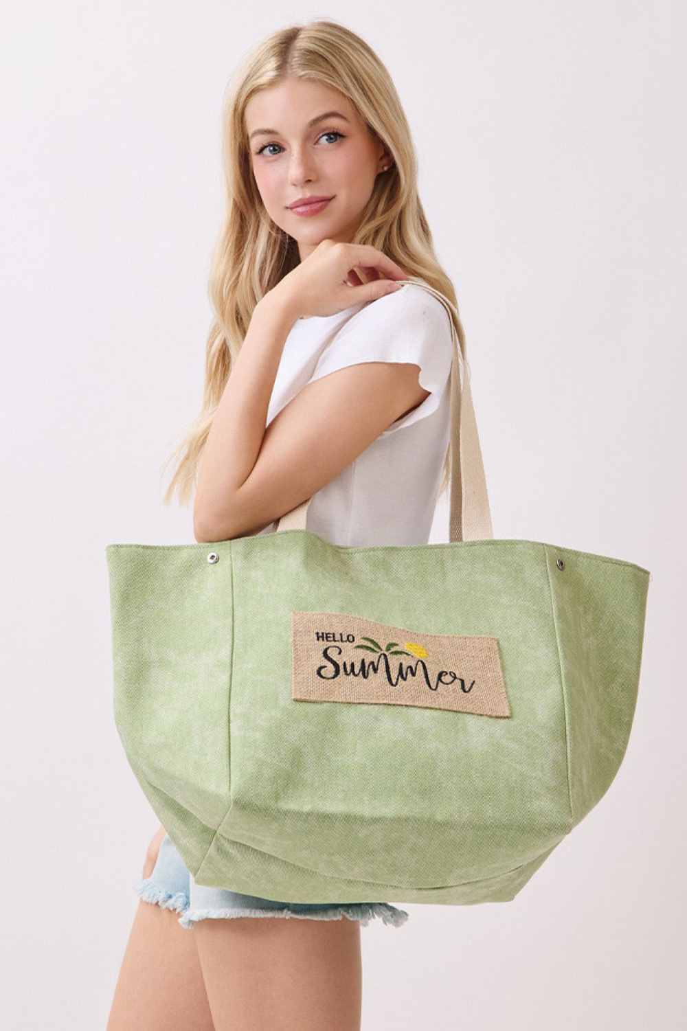 Mint Carry your summer essentials in style with this versatile shoulder and bucket-style canvas tote. Featuring a cheerful "HELLO SUMMER" letter design, it's the perfect companion for beach days, farmers markets, or everyday adventures. Crafted from a durable blend of 90% polyester and 10% burlap, this bag offers both strength and texture. The spacious 22" x 13" x 9.5" dimensions provide ample room for all your needs, while the magnetic snap closure keeps your belongings secure. An inner pocket adds conveni