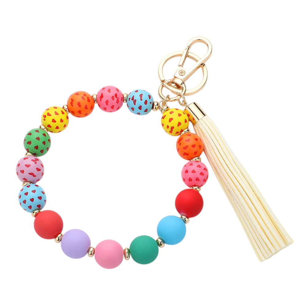 Multi Heart Patterned Beaded Tassel Keychain Bracelet is a charming addition to your accessory collection. Handcrafted with intricate beadwork and a delicate heart pattern, it can be used as a keychain or stylish bracelet. Elevate your style while keeping your keys or wrist secure with this beautiful piece.