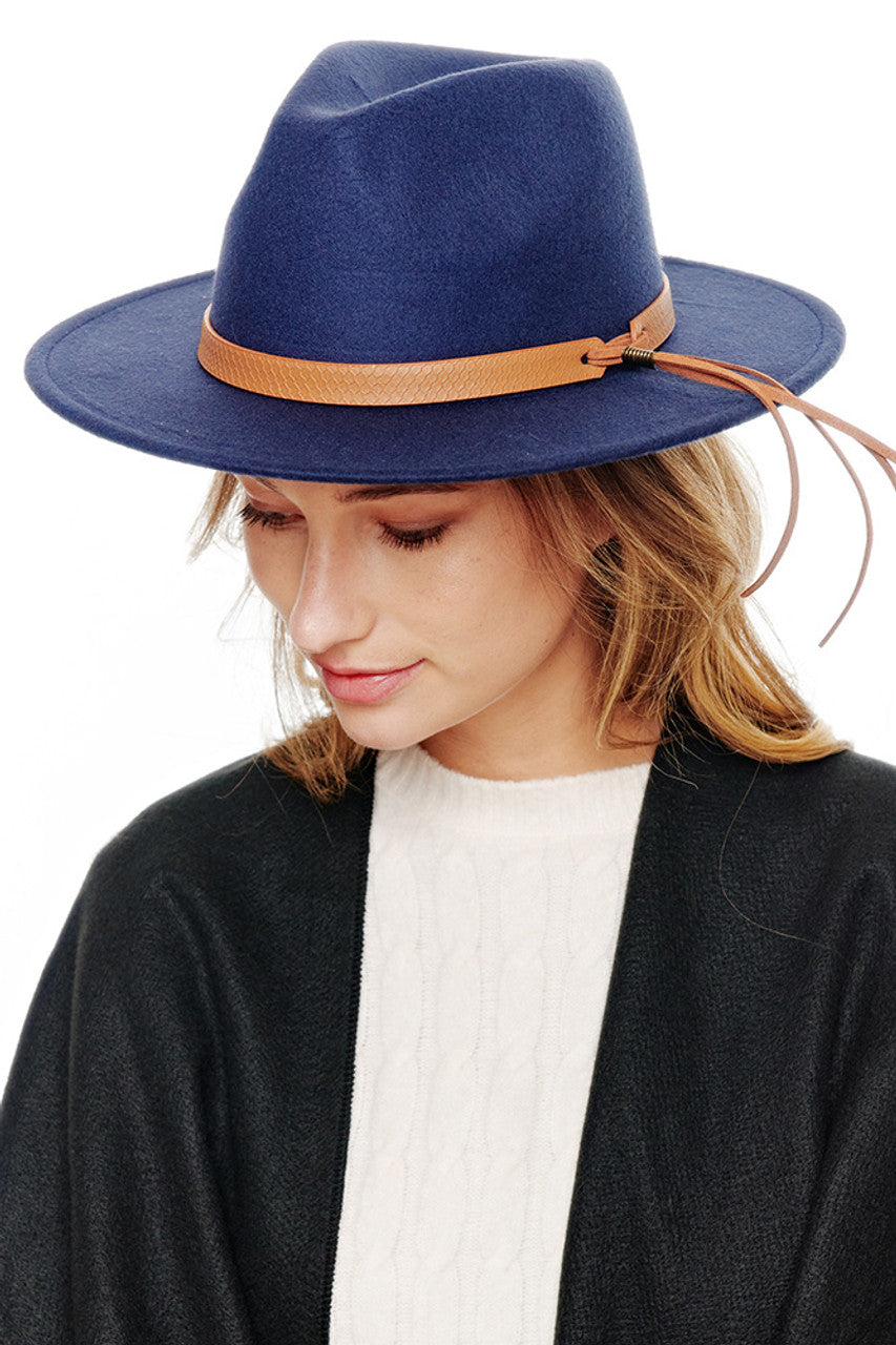 Navy Felt solid Fedora hat offers timeless sophistication with exceptional durability. The classic silhouette features a structured crown and well-proportioned brim that provides both style and practical sun protection. Its versatile design transitions seamlessly from casual to formal occasions, making it an essential addition to any discerning wardrobe.