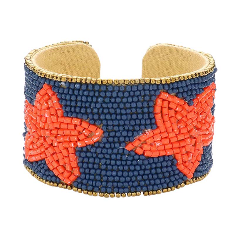 Navy Orange This Game Day Beaded Star Accented Cuff Bracelet adds a stylish touch to any ensemble. The beaded star accents on the cuff give it a unique, eye-catching design, perfect for game day or any day. Wear it to show your support for your favorite team - you're sure to stand out from the crowd.