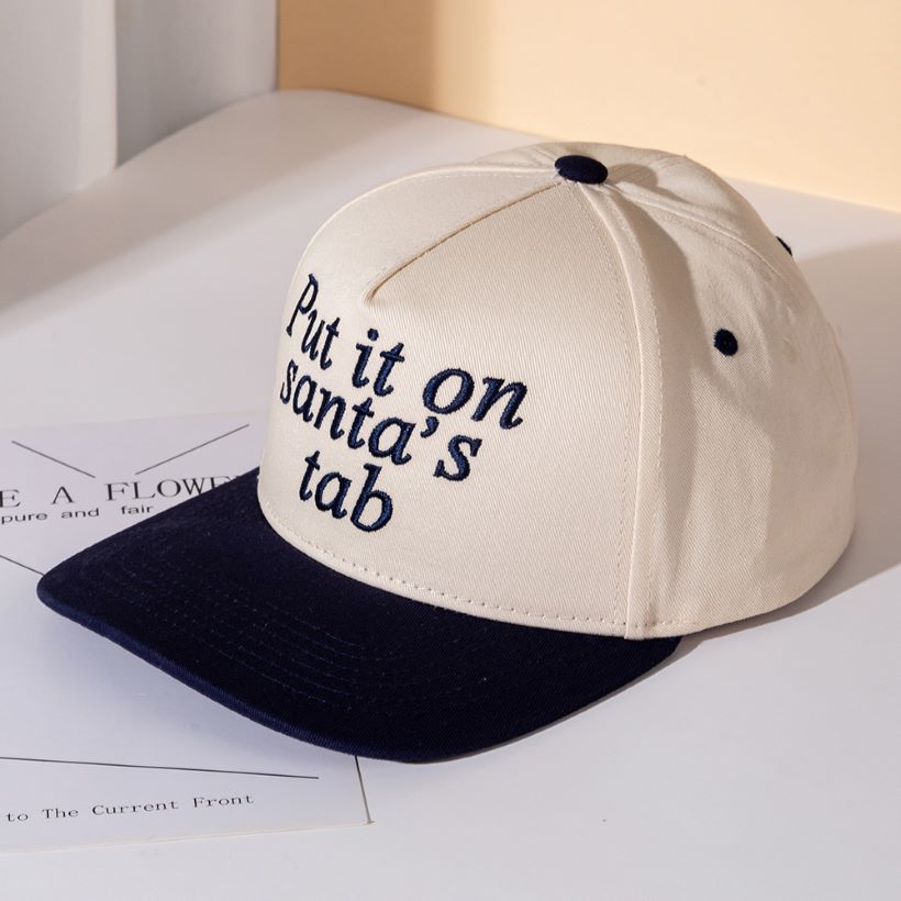 Add festive humor to your look with the Put It on Santa’s Tab baseball cap, a playful embroidered hat perfect for holiday parties, casual outings, or gifting. A fun seasonal accessory that spreads cheer while keeping your style relaxed and trendy.
