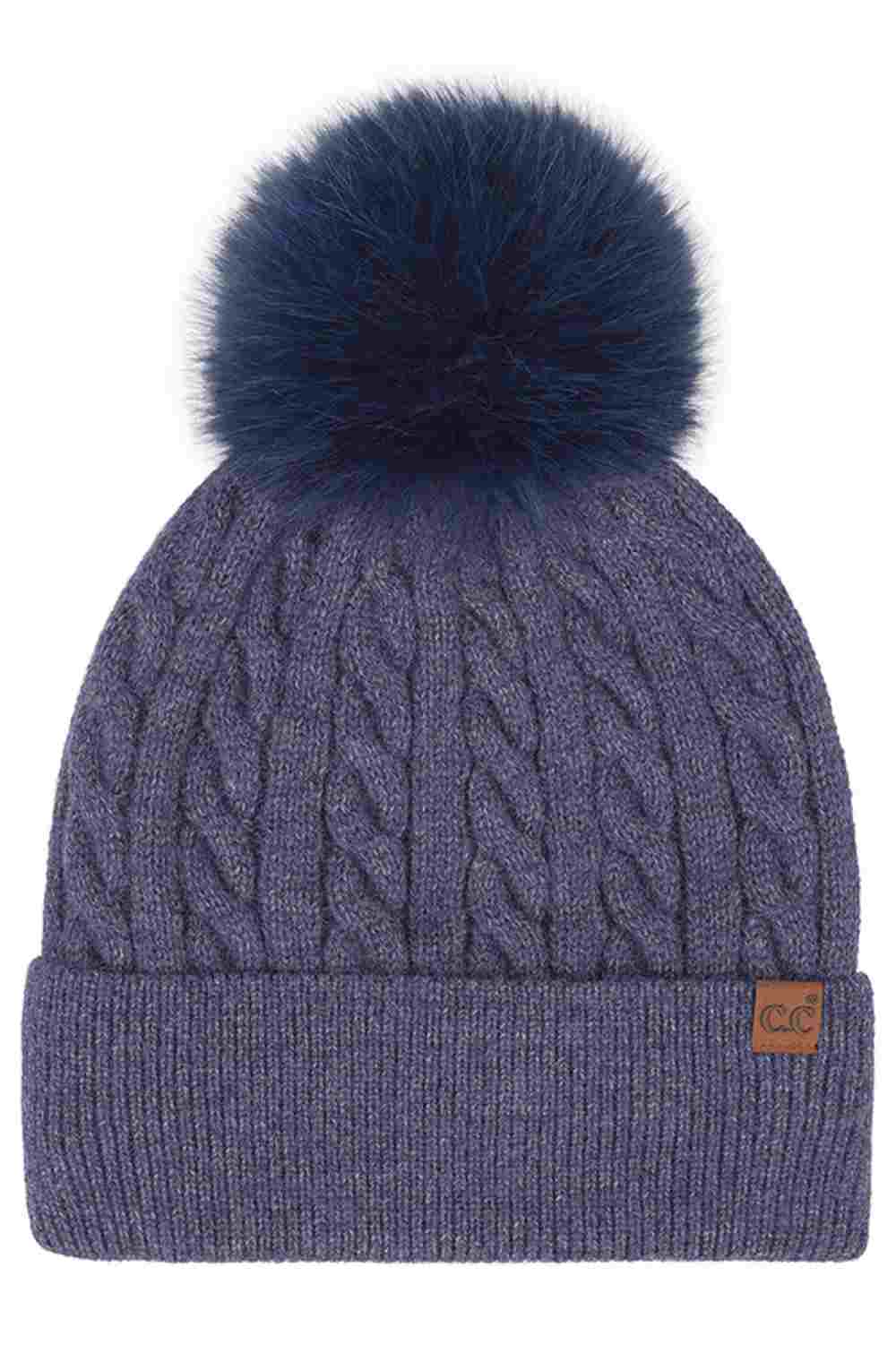 Navy C.C Cable Knit Pattern Pom and Cuff Beanie Hat features a classic cable-knit texture topped with a fluffy pom for a cozy, timeless winter look. Finished with a soft cuff and stretch fit, it keeps you warm and comfortable while adding effortless style to cold-weather outfits.