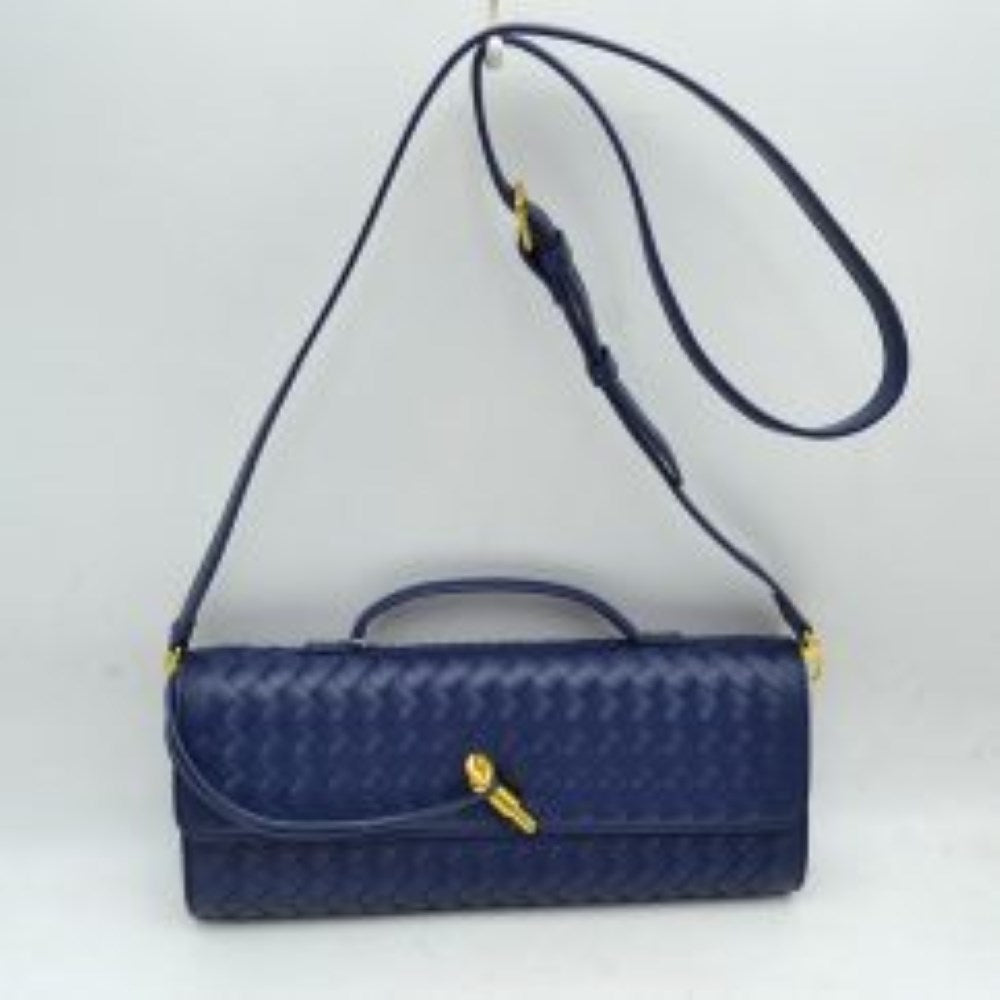 Navy blue This structured shoulder bag features an intricate woven exterior design with an elongated East-West silhouette, making it a sophisticated choice for modern everyday use. The front flap is detailed with a slim, flat top handle that rests close to the body and is highlighted by a distinctive, polished gold-tone metal clasp accent. Completed with a matching adjustable long shoulder strap secured by gold-tone hardware, this versatile bag can be easily styled as a shoulder bag or a crossbody.
