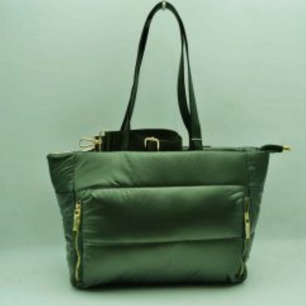 Olive This versatile tote bag features a modern puffer design with horizontal quilted panels and a sleek satin-like finish, making it a stylish choice for everyday organization. It is equipped with dual flat shoulder handles for comfortable carrying, alongside a secondary adjustable fabric crossbody strap attached with metallic gold-tone hardware. The main storage compartment secures with a full top zipper closure