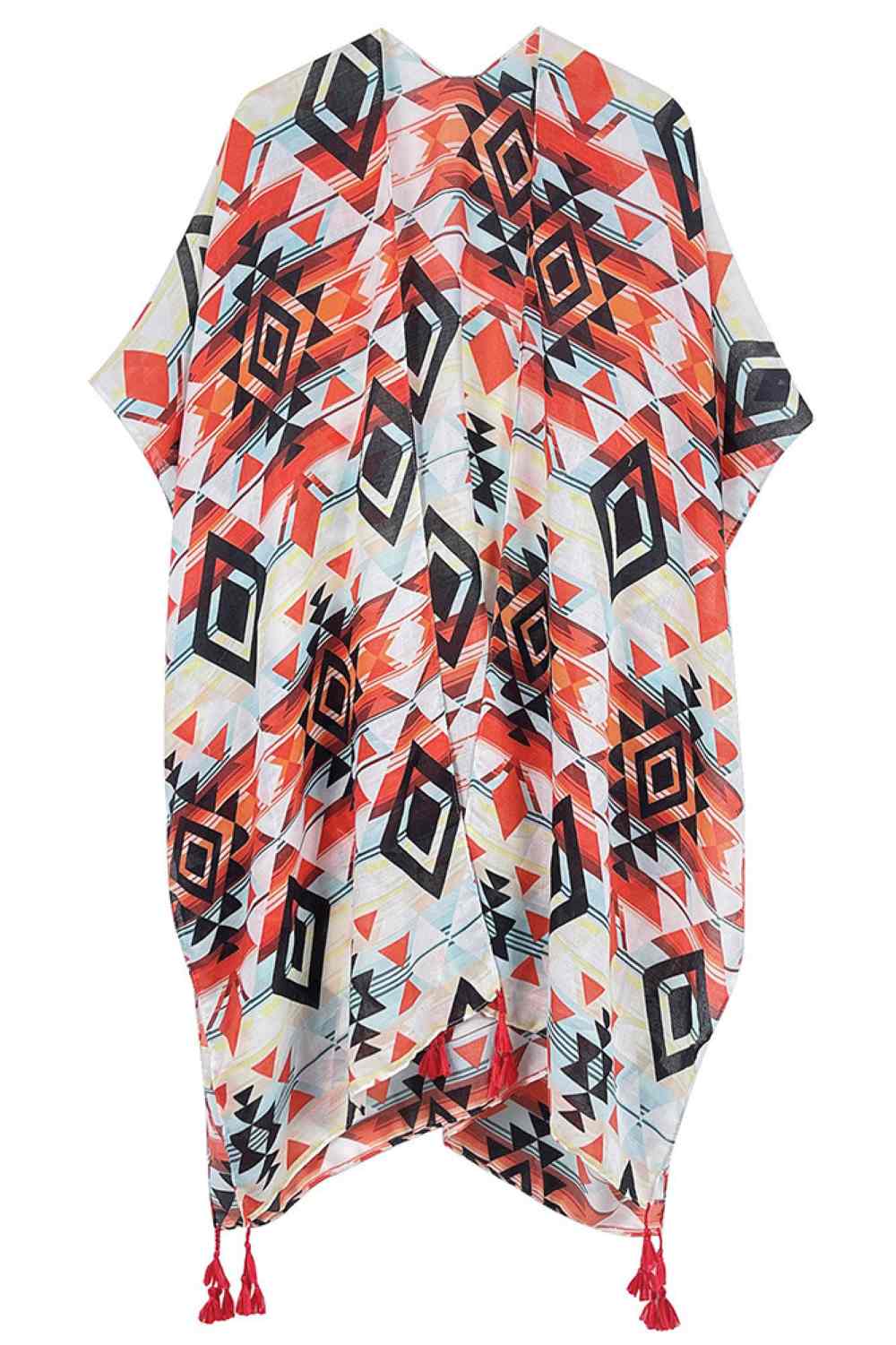 Orange Embrace bohemian elegance with this striking Aztec Pattern Print Tassel Kimono. Crafted from lightweight 100% polyester, this versatile piece features bold geometric patterns inspired by traditional Aztec designs, complete with decorative tassels for added flair. Perfect for layering over dresses, swimwear, or casual outfits, it drapes beautifully with a generous 35.4" length and width. Ideal for beach days, festivals, or relaxed weekend wear. Made in China.