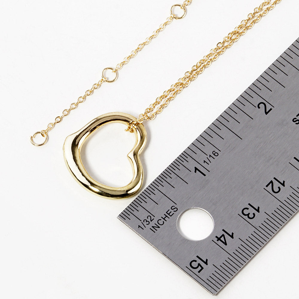 Metal Heart Cut-Out Pendant Necklace showcases a modern cut-out design, adding a touch of elegance to any outfit. Made with high-quality materials, this necklace is both durable and stylish. Elevate your look with this versatile accessory that perfectly blends beauty and functionality.