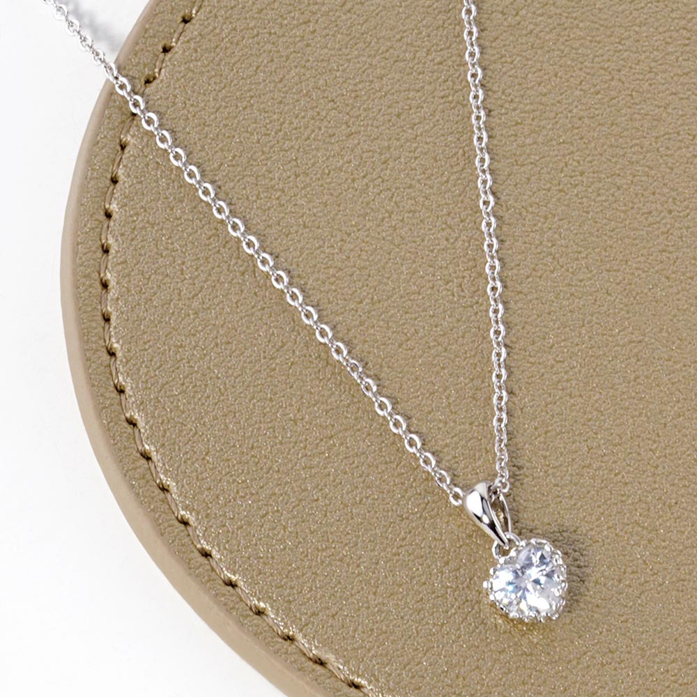 Rhodium White Gold Dipped Heart Stone Pendant Necklace is perfect for adding a touch of elegance to any outfit. Crafted with precision and sophistication, the necklace is designed to showcase a sparkling heart-shaped stone, complemented by white gold plating for a luxurious finish. Elevate your style with this stunning piece.