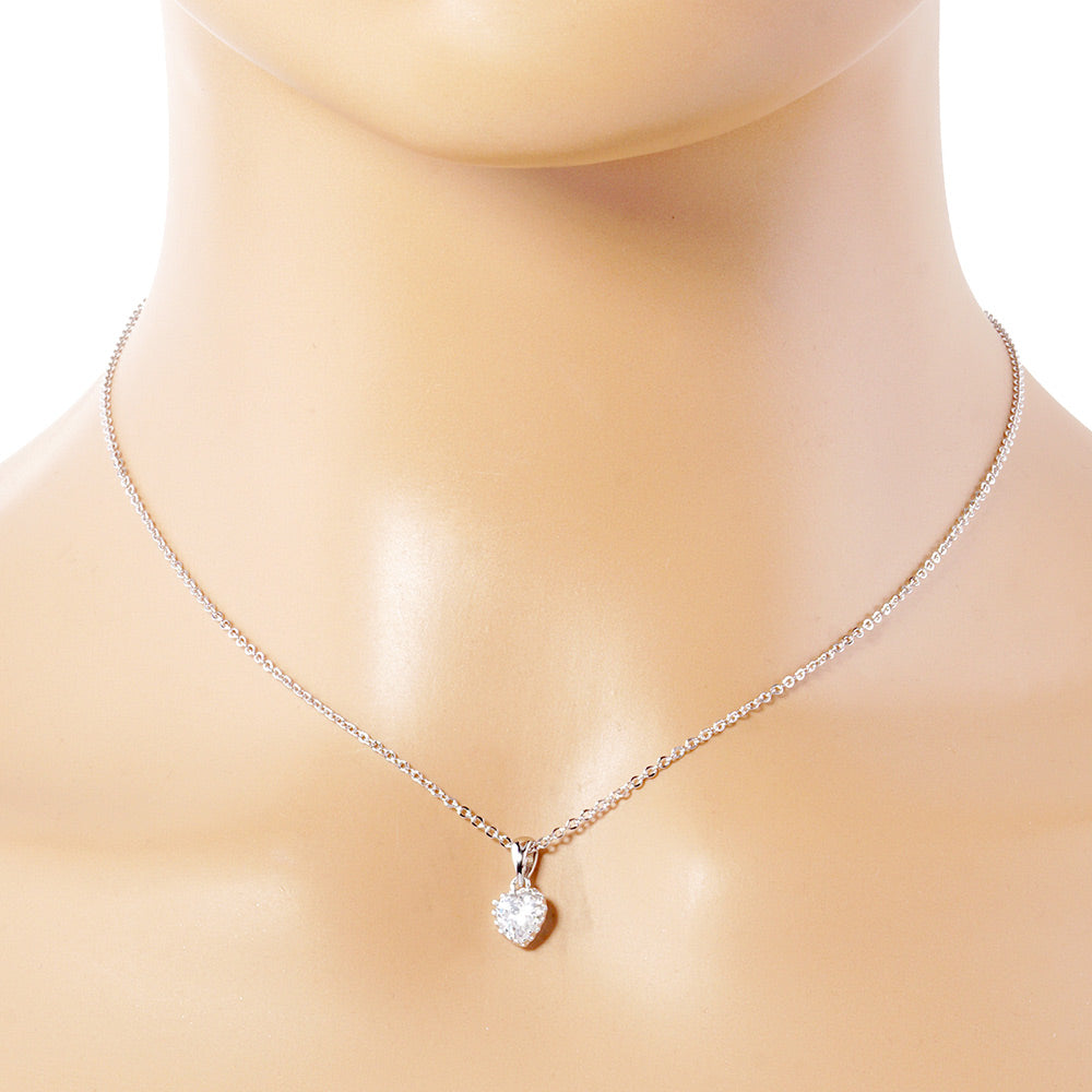 Rhodium White Gold Dipped Heart Stone Pendant Necklace is perfect for adding a touch of elegance to any outfit. Crafted with precision and sophistication, the necklace is designed to showcase a sparkling heart-shaped stone, complemented by white gold plating for a luxurious finish. Elevate your style with this stunning piece.