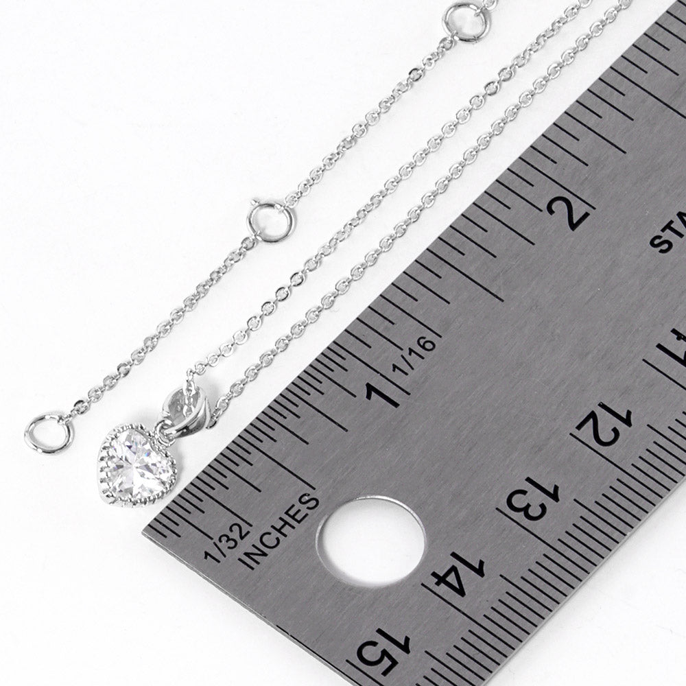 Rhodium White Gold Dipped Heart Stone Pendant Necklace is perfect for adding a touch of elegance to any outfit. Crafted with precision and sophistication, the necklace is designed to showcase a sparkling heart-shaped stone, complemented by white gold plating for a luxurious finish. Elevate your style with this stunning piece.