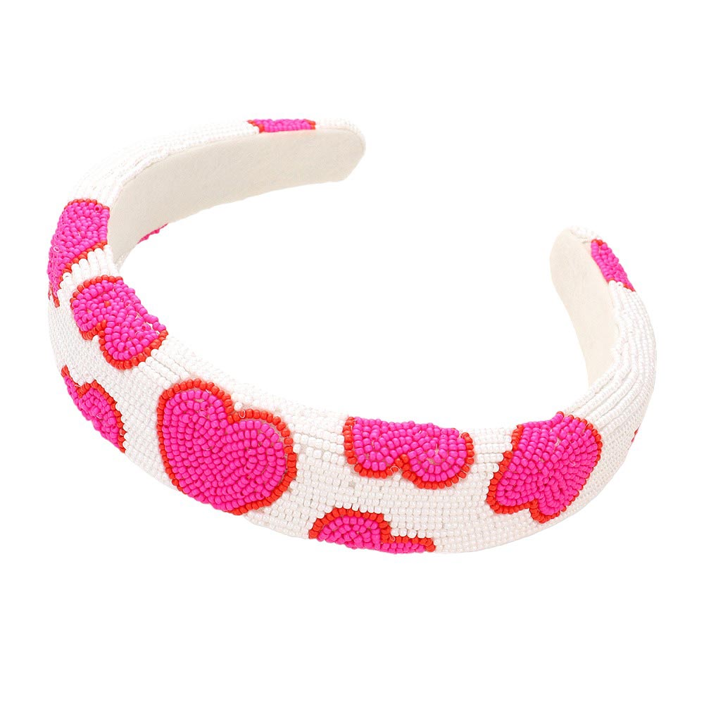 Pink Seed Beaded Heart Patterned Padded Headband, features a stunning heart pattern and comfort. Constructed with quality materials, this headband is soft and adjustable for a perfect fit. Show your unique style with this eye-catching accessory. Perfect gift accessory idea for fashion-loving friends and family members.