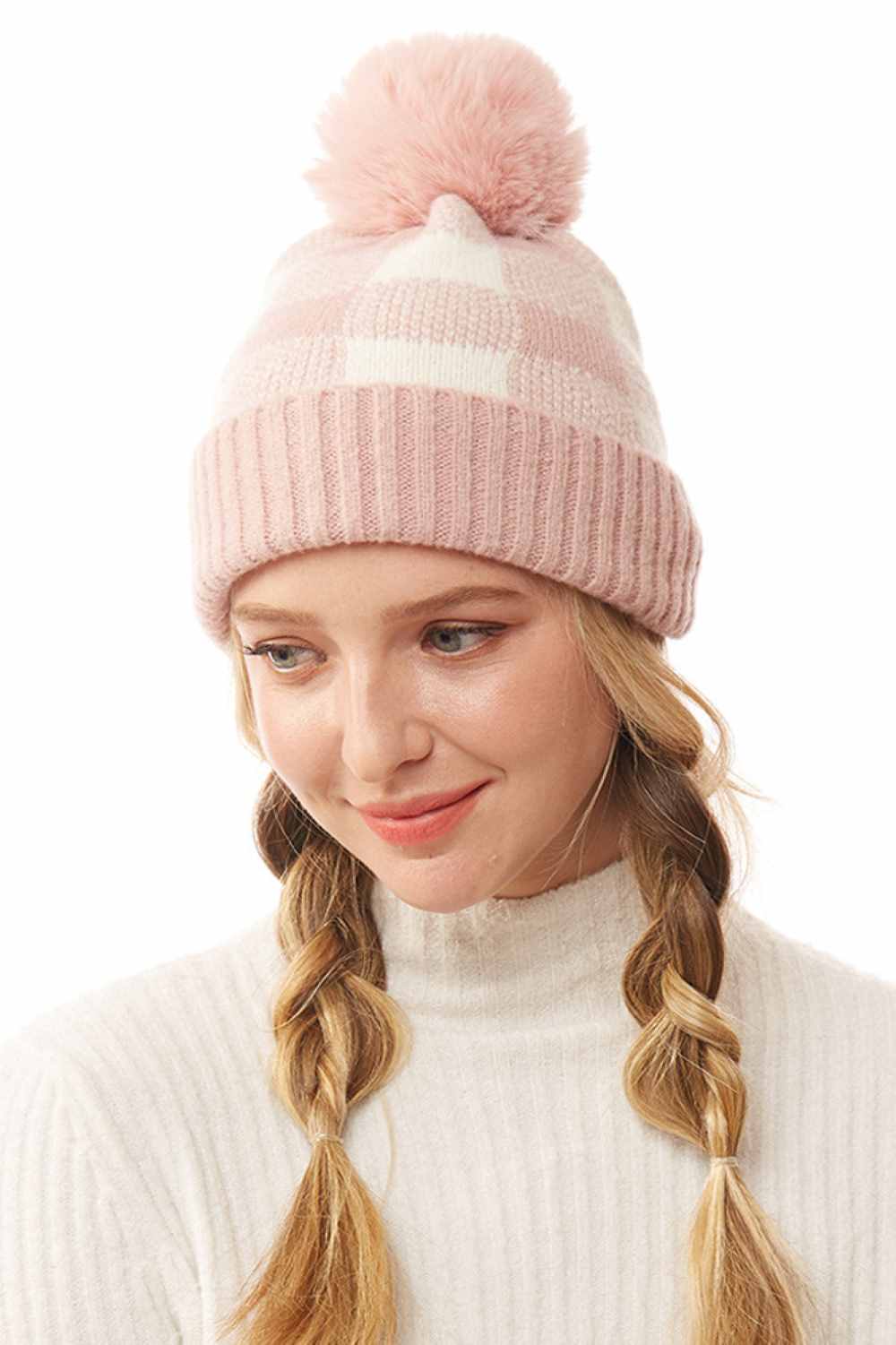 Pink The Buffalo Check Beanie with Pom Pom features a classic plaid design that brings timeless style to your winter wardrobe. Made from soft, cozy knit fabric with a playful pom pom accent, it offers warmth, comfort, and a snug fit for chilly days.