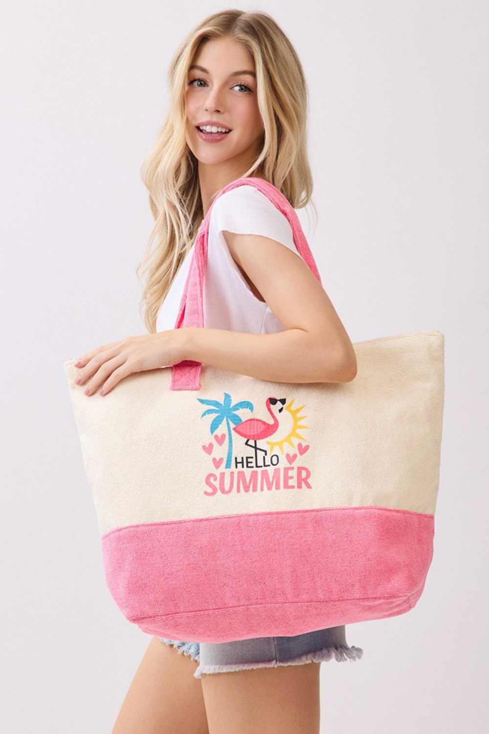 Pink Brighten your summer days with this vibrant terry tote bag featuring a cheerful "HELLO SUMMER" letter design and playful flamingo motif. Crafted from a durable polyester and polyamide blend, this spacious 22" x 16" x 6" bag is perfect for beach trips, shopping, or everyday adventures. The secure zipper closure keeps your essentials safe, while the convenient inner pocket adds extra organization. Whether you're heading to the shore or running errands around town, this fun and functional tote brings a sp