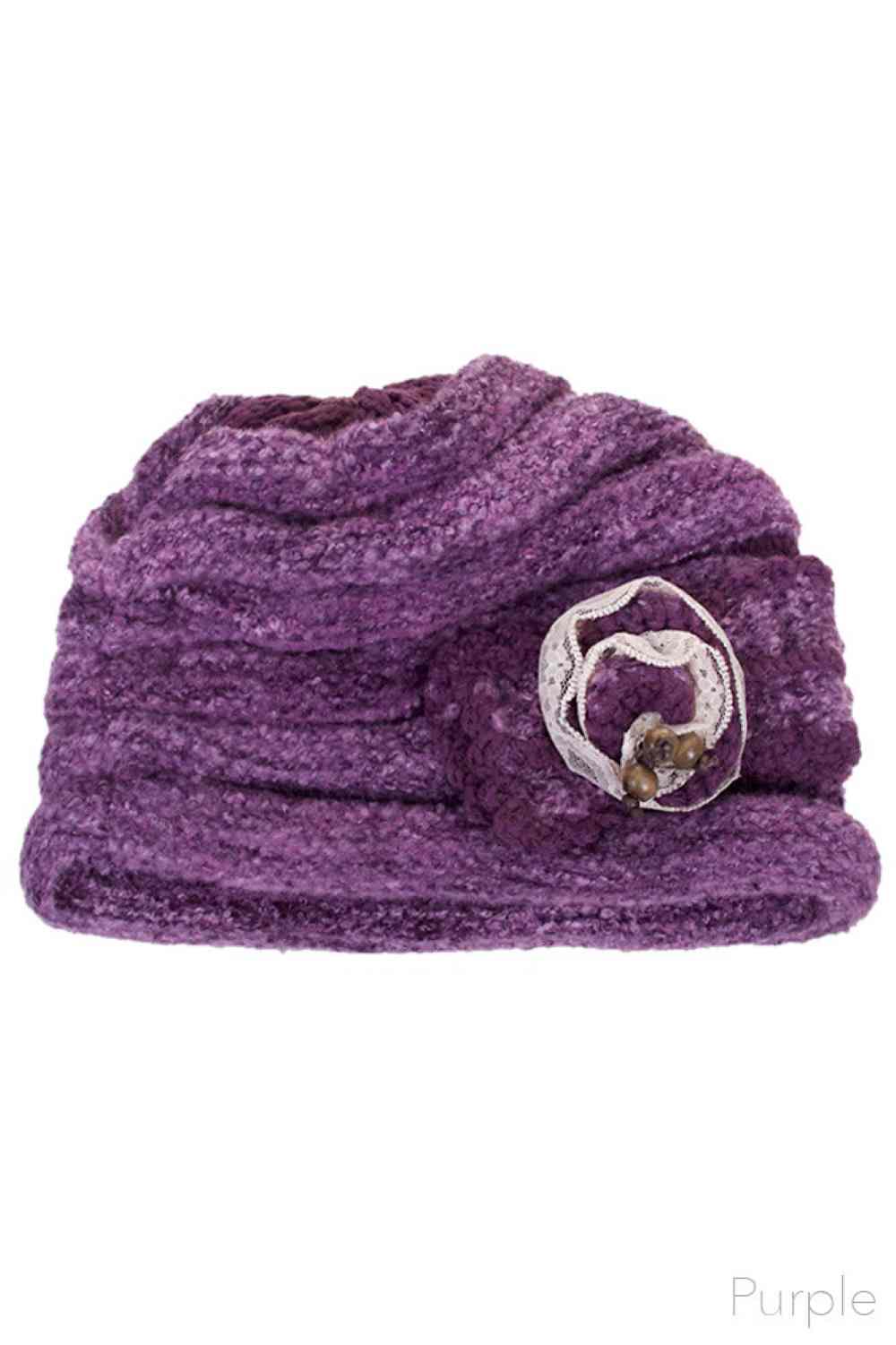 Purple Elevate your winter wardrobe with this C.C Lace Bow Trim Knitted Beanie, crafted from 100% soft acrylic for ultimate comfort and warmth. The delicate lace bow trim adds a feminine touch to this classic cold-weather essential, while the quality knit construction ensures durability through countless seasons. Perfect for layering with your favorite outfits, this beanie del
