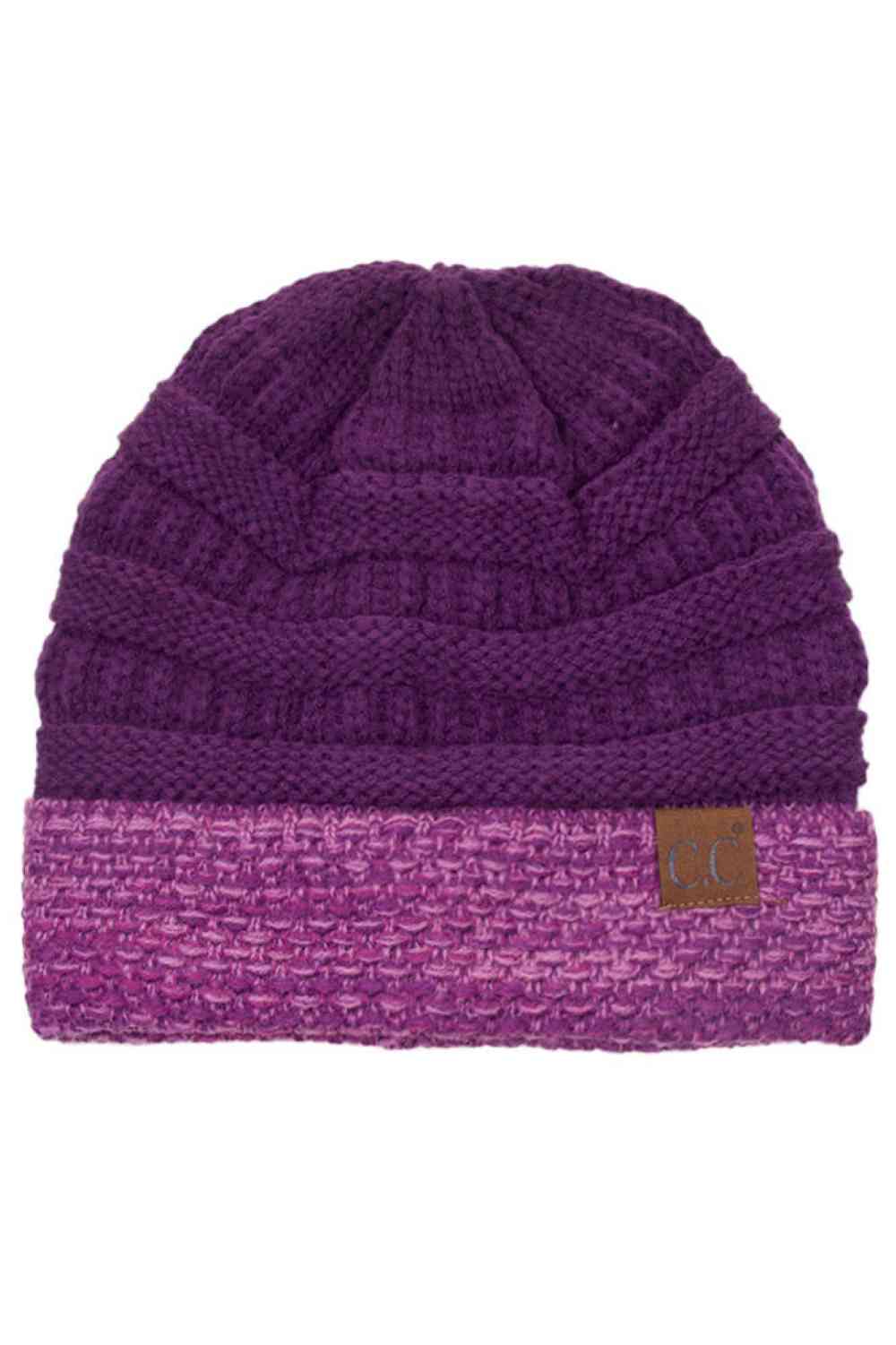 Purple The C.C Two Tone Cable Knit Beanie delivers cozy warmth with a classic aesthetic. Made from 100% acrylic, this durable beanie features a comfortable cuff design perfect for everyday wear.