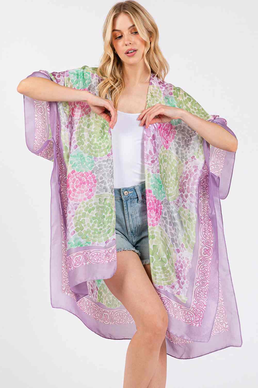 Purple Elevate your summer wardrobe with this stunning multi-color abstract circle pattern kimono cover-up. Crafted from 100% polyester, it features a luxuriously silky feel that drapes beautifully against your skin. Perfect for beach days, poolside lounging, or casual outings, this versatile piece transitions effortlessly from day to night. The vibrant abstract design adds an artistic touch to any outfit. Generously sized at 35" x 36", it offers comfortable coverage and movement. An essential layering piec