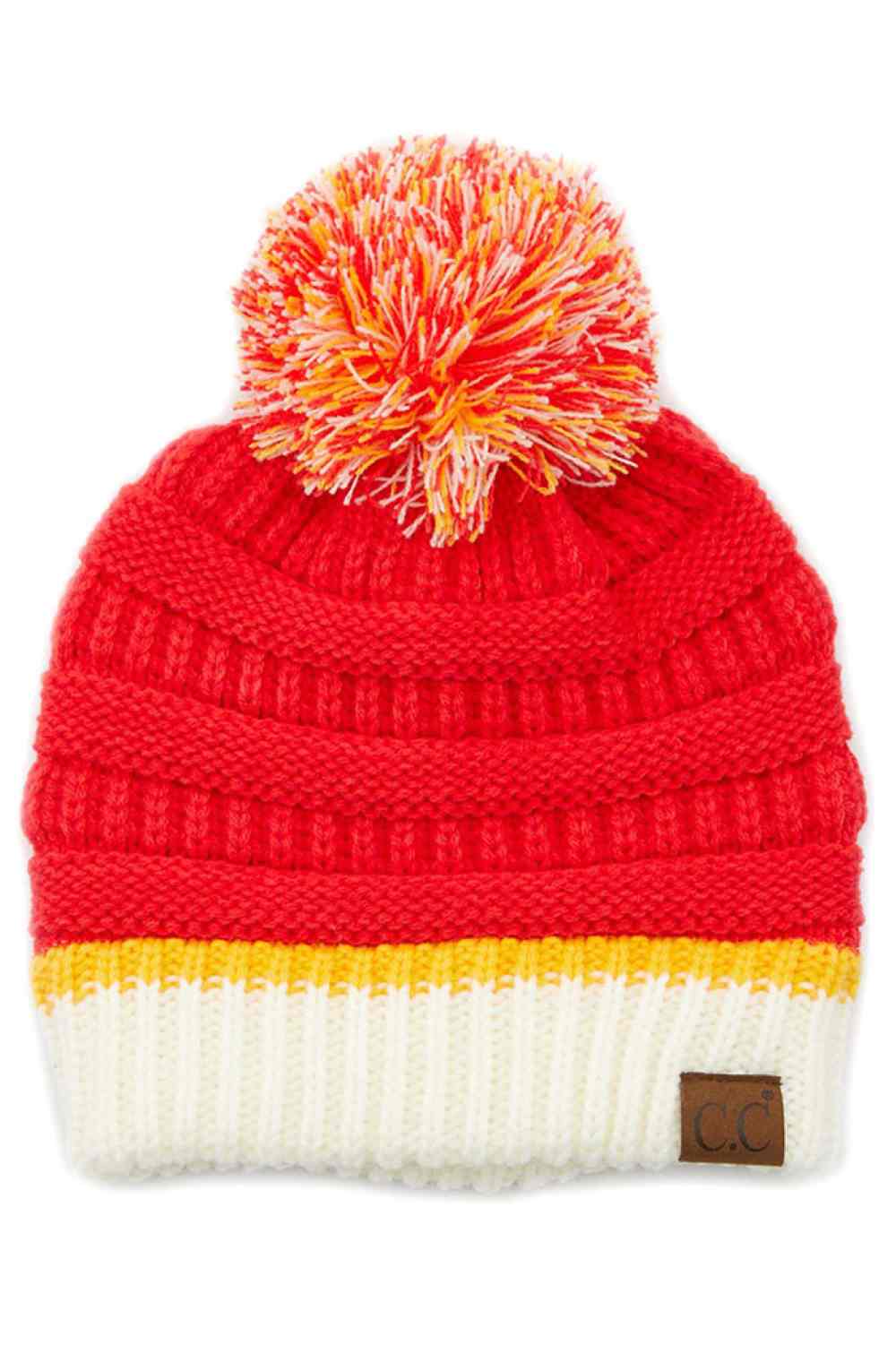 Red White The C.C Team Color Ribbed Beanie combines style and comfort in one versatile piece. Crafted from 100% acrylic, this beanie features a classic ribbed knit design with a playful pom on top, making it perfect for staying warm during chilly days.
