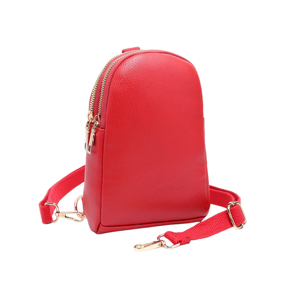 Red Solid Faux Leather Sling Bag, is the perfect combination of style and convenience. Crafted from durable faux leather, it can withstand daily wear and tear and its adjustable shoulder strap ensures a comfortable fit. Perfect Birthday Gift, Anniversary Gift, Mother's Day Gift, Graduation Gift, Valentine's Day Gift.
