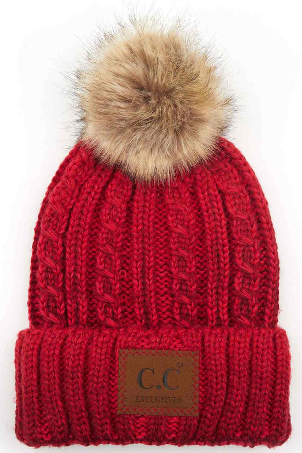 Red Elevate your winter wardrobe with this C.C ombre beanie featuring a plush faux fur pom. Crafted from 100% acrylic, the soft knit construction provides warmth and comfort without bulk. Perfect for casual outings or layering under winter gear.