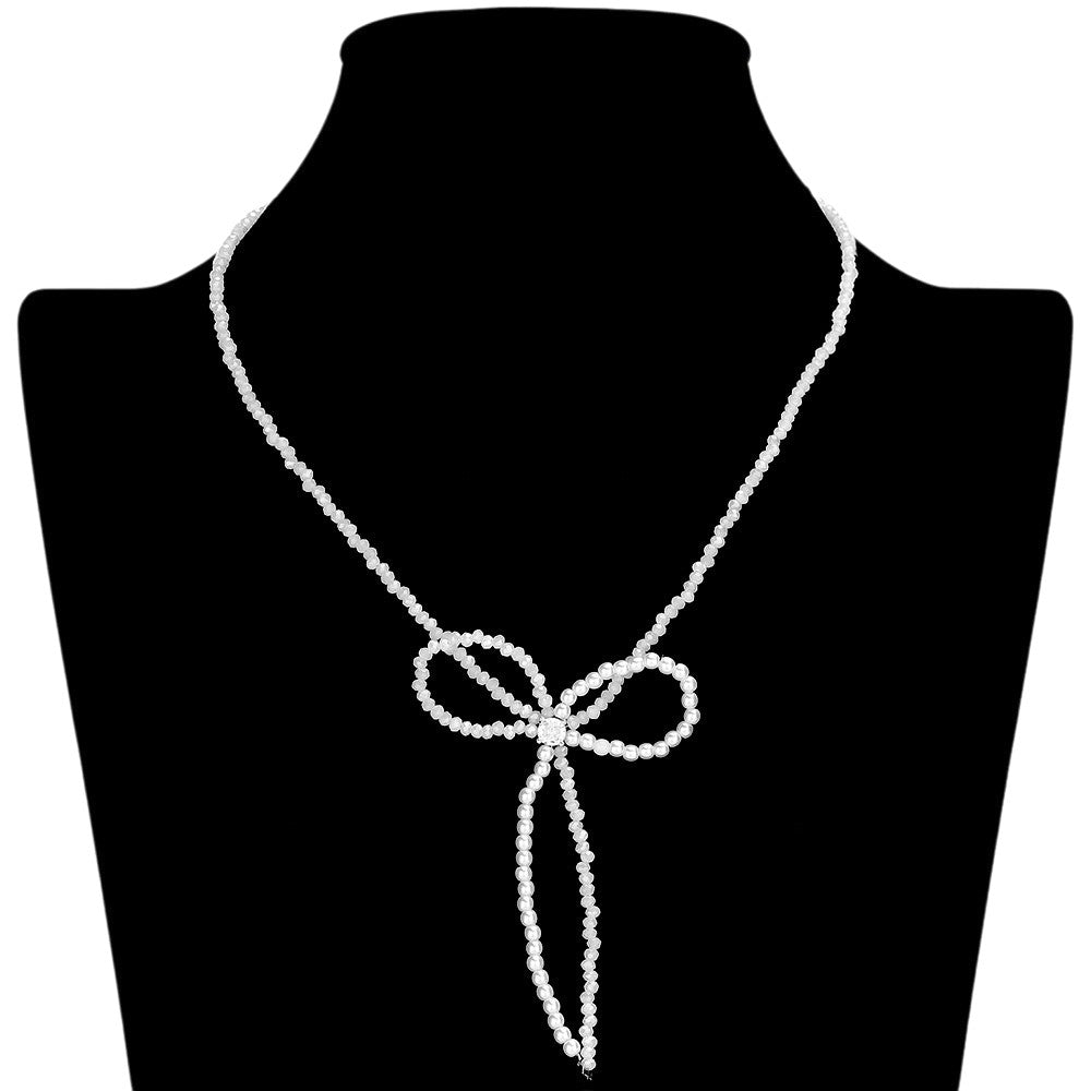 Rhodium SECRET BOX_Stone Pointed Faceted Beaded Bow Necklace is expertly crafted with precision and style. The pointed faceted beads create a unique and eye-catching design, while the delicate bow adds a touch of elegance. Perfect for adding a sophisticated touch to any outfit.