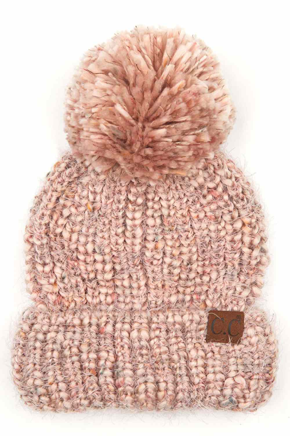 Rose The C.C Multicolor Feather Yarn Beanie with Pom is a cozy, stylish knit hat featuring vibrant, multicolored yarn and a playful pom-pom on top. Perfect for adding a pop of color to your winter wardrobe while keeping you warm and comfortable.