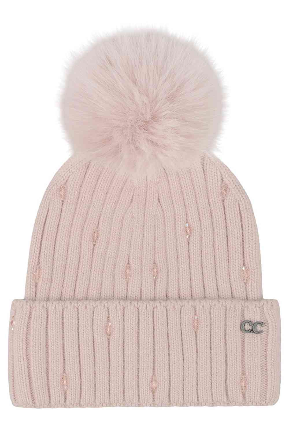 Rose C.C Glass Bead Embellishment with Faux Fur Pom Cuff Beanie Winter Hat sparkles with elegant glass bead detailing and is finished with a plush faux-fur pom for a stylish cold-weather look. Crafted with a soft stretch fit, this cozy cuff beanie keeps you warm while adding a touch of glam to your winter outfits.
