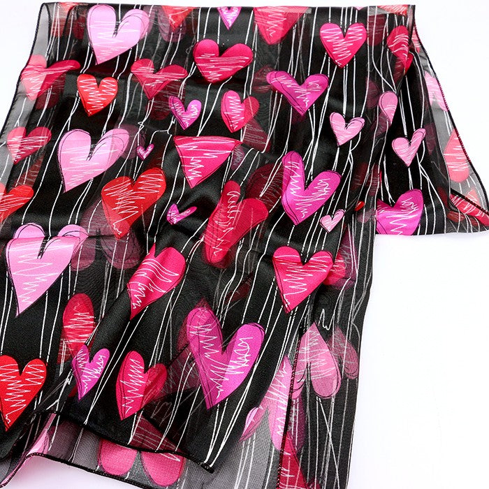 Black Silk Feel Striped Heart Pattern Scarves are designed with a soft and luxurious silk-like material that guarantees comfortable and lightweight wear. The elegant striped heart pattern adds a touch of sophistication to any outfit. Perfect as a gift or a stylish addition to your wardrobe.