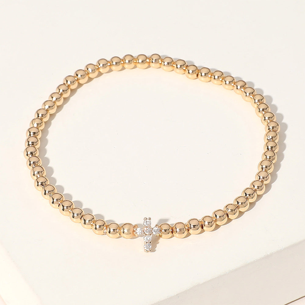 Madeline Love Gold Stone Paved Cross Brass Ball Beaded Stretch Bracelet