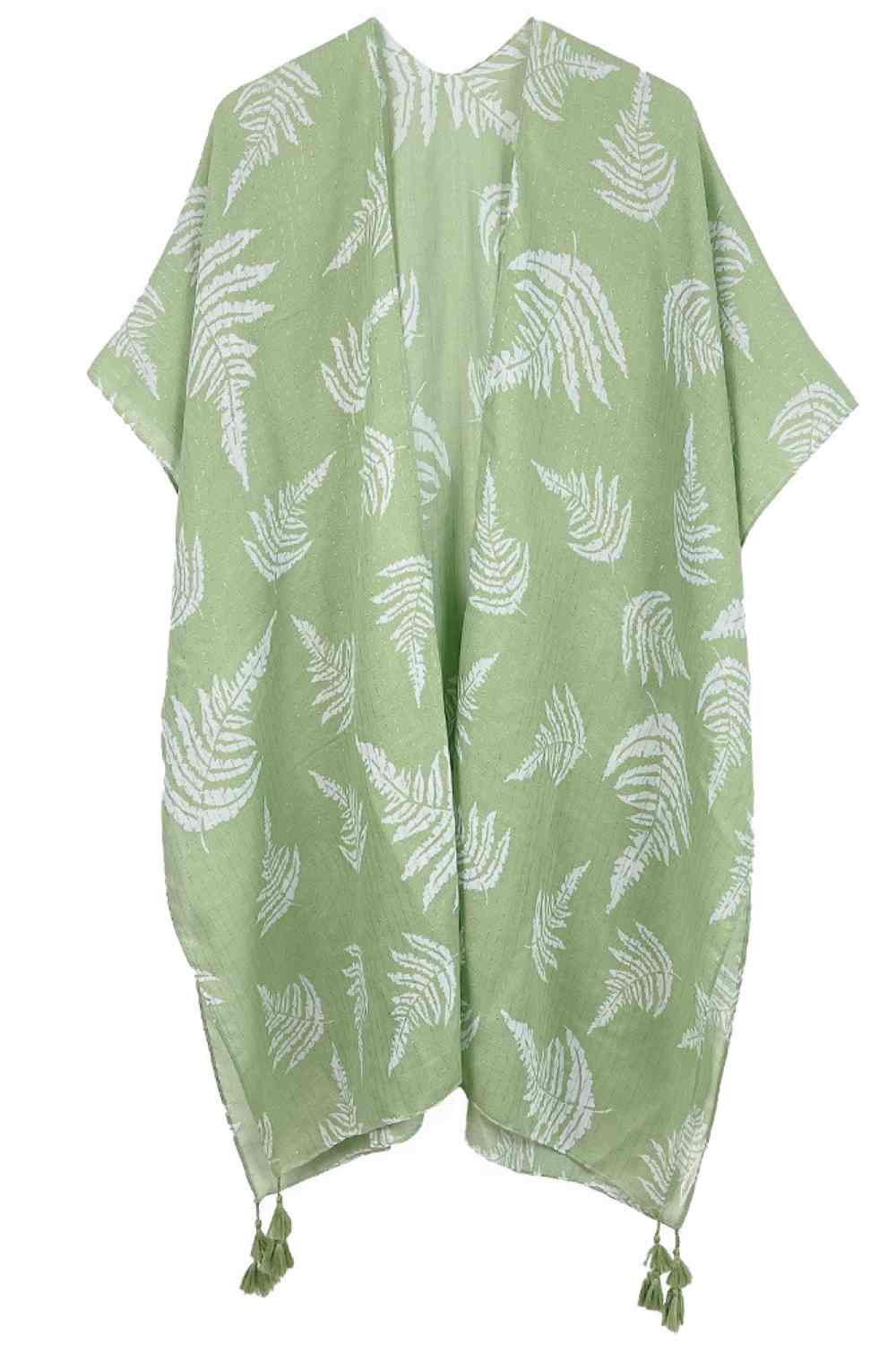 Sage Effortless elegance meets bohemian charm with this stunning leaf print kimono. Crafted from lightweight polyester, it features a sophisticated two-tone design accented with shimmering lurex threading and playful tassels at the hem. The generous 35.4" x 35.4" dimensions provide a relaxed, flowing fit perfect for layering over any outfit. Whether you're heading to the beach, a casual brunch, or an evening out, this versatile piece transitions seamlessly from day to night. A wardrobe essential that brings