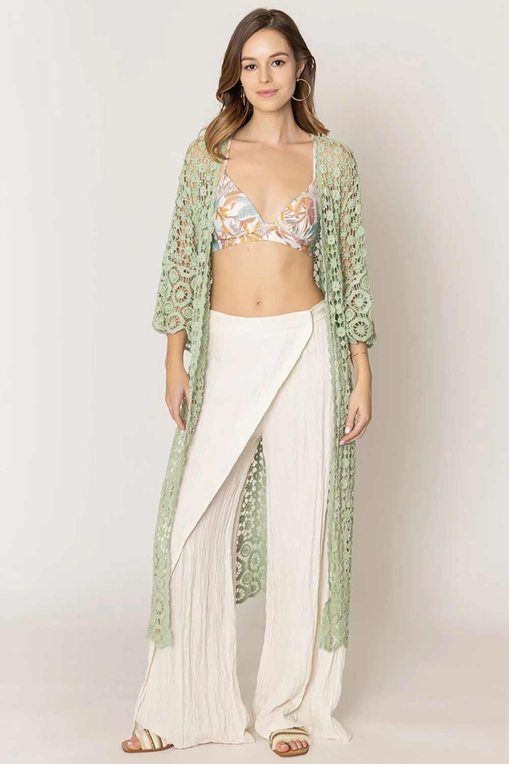 Sage Effortless layering meets timeless style with this solid crochet cardigan. Crafted from 100% cotton, it offers breathable comfort perfect for any season. The relaxed fit and open-front design make it ideal for pairing over dresses, tees, or tanks. With generous dimensions of 43.3" x 21.3", this versatile piece transitions seamlessly from casual days to evening outings. A wardrobe essential that works as hard as you do.