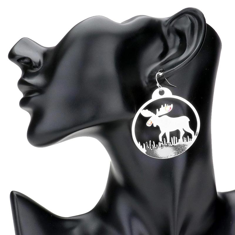 Silver-Stone Embellished Rudolph Accented Brass Metal Round Dangle Earrings, Add a touch of festive charm to any outfit. Made with high-quality brass metal and adorned with sparkling stones, these round dangle earrings are perfect for any occasion. The Rudolph accent adds a playful touch to the elegant design.