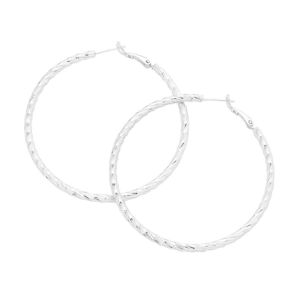 Silver 2.3 Inch Textured Brass Metal Hoop Earrings, turn your ears into a chic fashion statement with these brass metal hoop earrings! The beautifully crafted design adds a gorgeous glow to any outfit. Put on a pop of color to complete your ensemble in perfect style. These adorable textured earrings are bound to cause a smile.