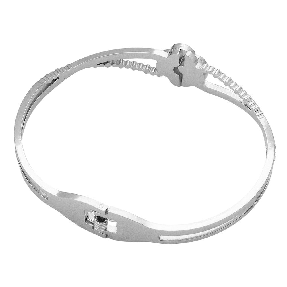Silver Mother Of Pearl Stone Paved Stainless Steel Hinged Bangle Bracelet adds a touch of elegance to any outfit. The shimmering mother-of-pearl stones are intricately paved on a durable stainless steel hinged bangle, providing both style and durability. Elevate your jewelry collection with this stunning piece.