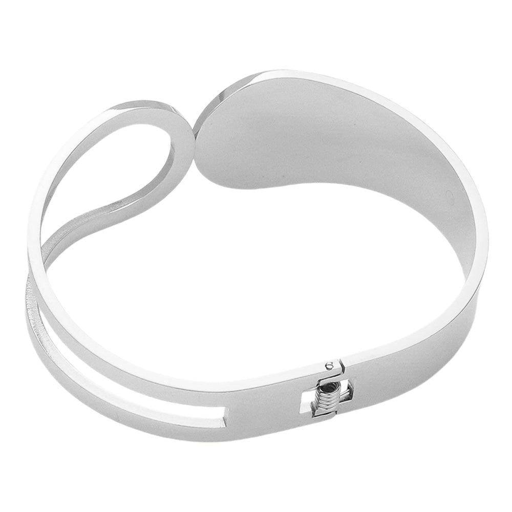 Silver Stainless Steel Abstract Hinged Bangle Bracelet features a beautiful and modern abstract design. Crafted with high-quality stainless steel, it is durable and resistant to corrosion. The hinged closure provides a secure and comfortable fit. Elevate your style with this unique and timeless bracelet.