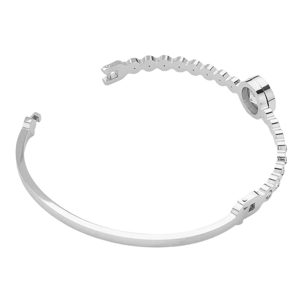 Silver Stainless Steel Round CZ Stone Bezel Hinged Bangle Bracelet. Made with high-quality stainless steel and featuring beautifully cut CZ stones in a bezel setting, this bangle adds a touch of elegance to any outfit. With a hinged design, it is easy to put on and take off for a comfortable fit. Elevate your style with this sophisticated accessory.