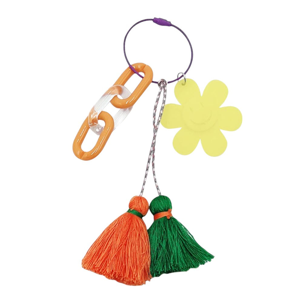 yellow Smile Flower Tassel Bag Charm/Keychain adds a touch of whimsy and charm to your bag or keys. The vibrant colors and playful design are sure to bring a smile to your face. Made with high-quality materials, this accessory is both durable and stylish.
