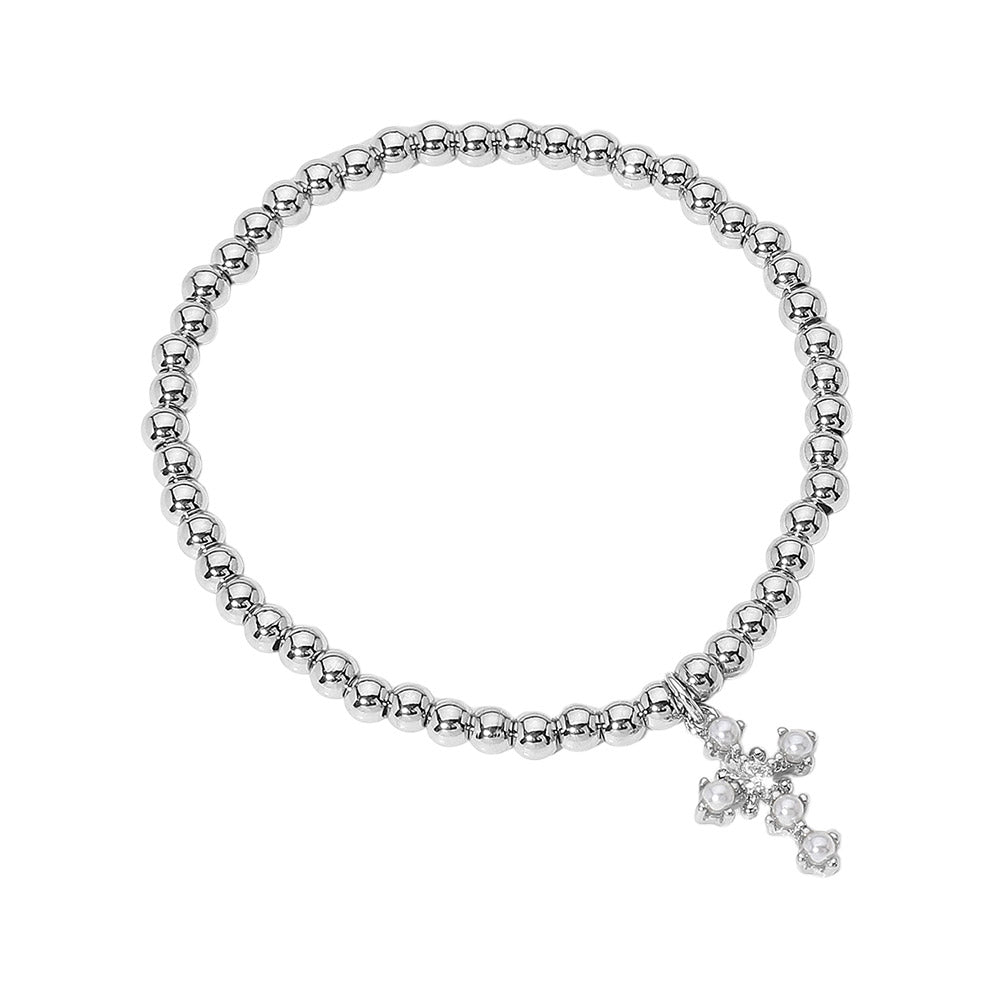 Silver Stainless Steel Ball Pearl Cross Charm Beaded Stretch Bracelet is a stunning piece of jewelry that adds a touch of elegance to any outfit. Made with high-quality stainless steel, delicate pearl beads, and a charming cross charm, this bracelet is durable and stylish. The stretch design allows for a comfortable and adjustable fit. Perfect for any occasion, this bracelet is a must-have for any jewelry collection.