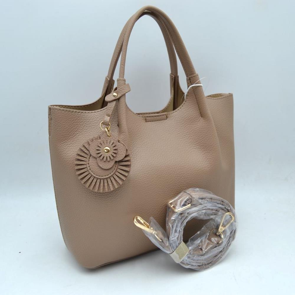 Taupe Elevate your everyday style with this versatile and sophisticated pebbled tote. Designed for the modern woman who values both form and function, this bag seamlessly transitions from a professional office setting to a casual weekend outing.
