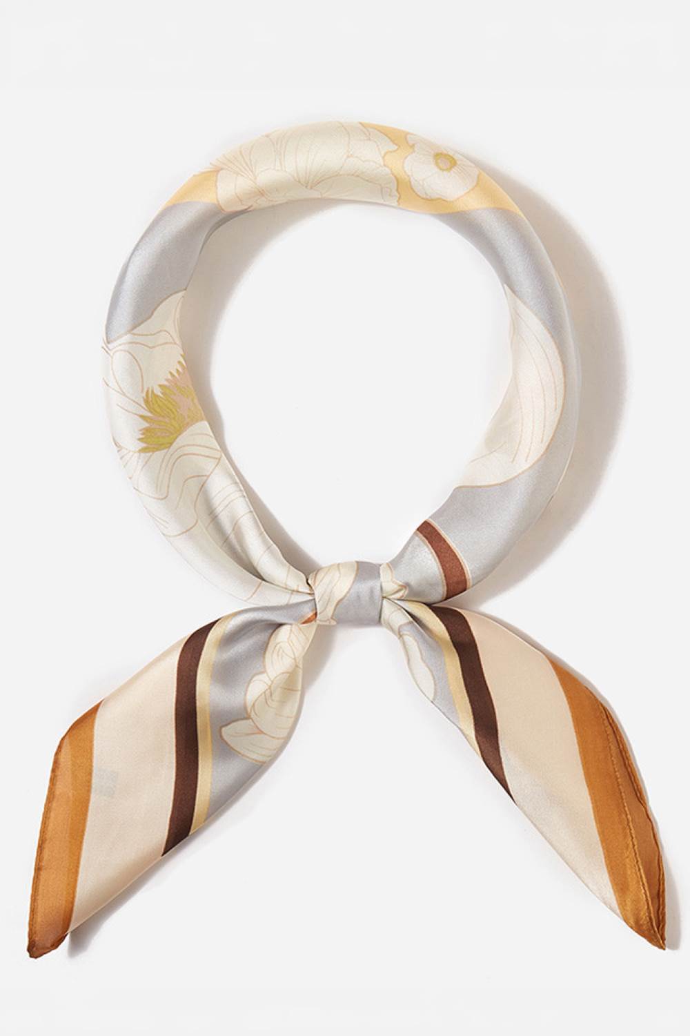 Taupe Brighten your summer style with this charming floral pattern blocks bandana scarf. Crafted from lightweight 100% polyester, it's perfect for warm weather wear tie it around your neck, head, or wrist for effortless versatility. The generous 27.5" x 27.5" square cut offers plenty of styling options. Whether you're heading to the beach, running errands, or adding a pop of color to any outfit, this easy-care scarf keeps you cool and fashionable all season long.