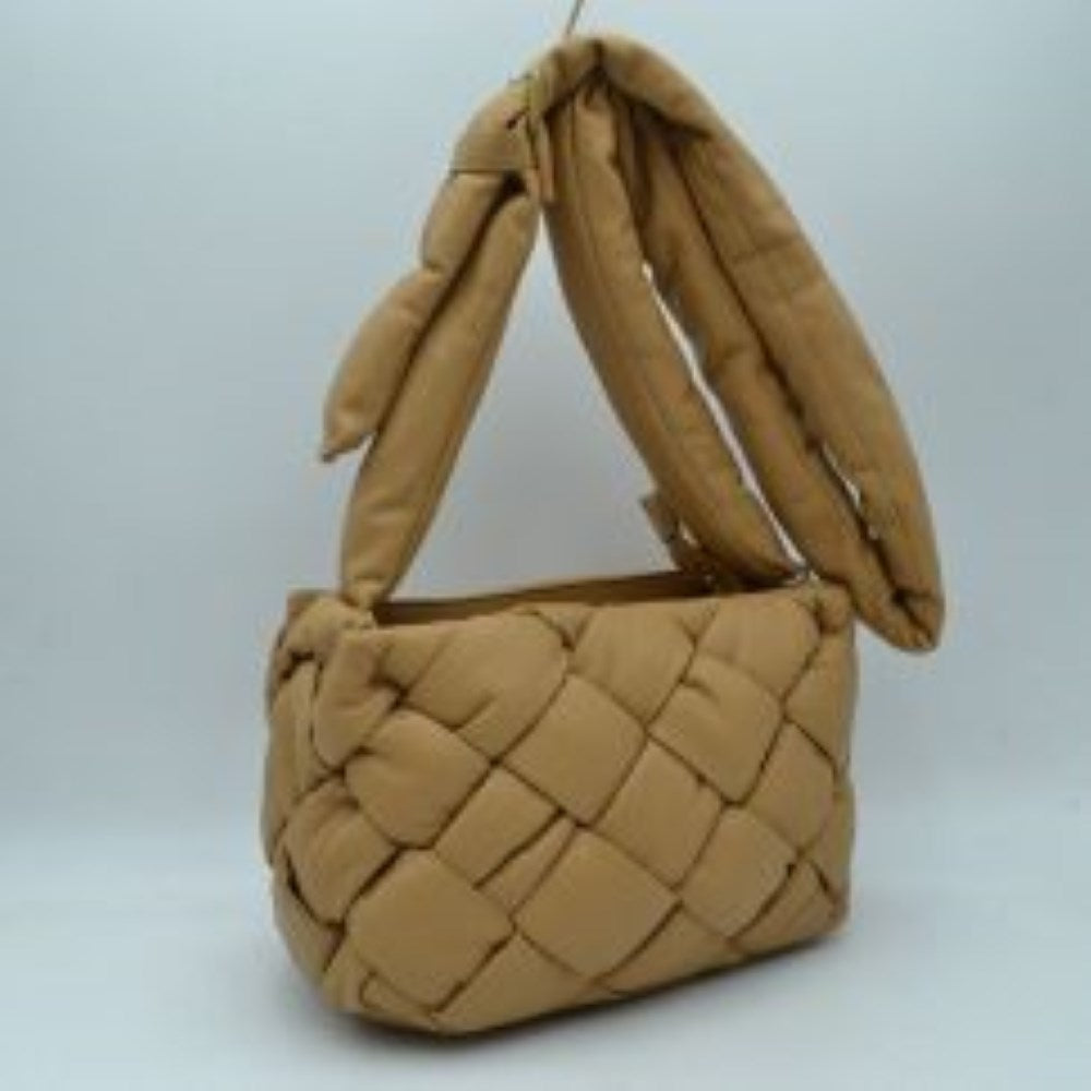 Taupe This unique handbag features a distinctive woven main compartment crafted with a thick, intertwined design for a modern, textured aesthetic. Perfect for everyday use, the bag is equipped with a generous open-top storage compartment to easily accommodate your daily essentials. A wide, matching puffy shoulder strap features a stylish knot detail near the base, ensuring comfortable carrying while adding a contemporary look to your outfit.