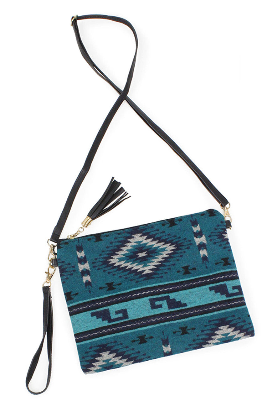 Teal Western Print Crossbody Clutch Bag combines distinctive southwestern-inspired patterns with practical design. Crafted for versatility, it offers a compact yet spacious interior ideal for essentials, while the adjustable crossbody strap ensures comfortable, hands-free wear. This bag is perfect for adding a touch of rustic charm to everyday outfits or special occasions, seamlessly blending style with functionality.