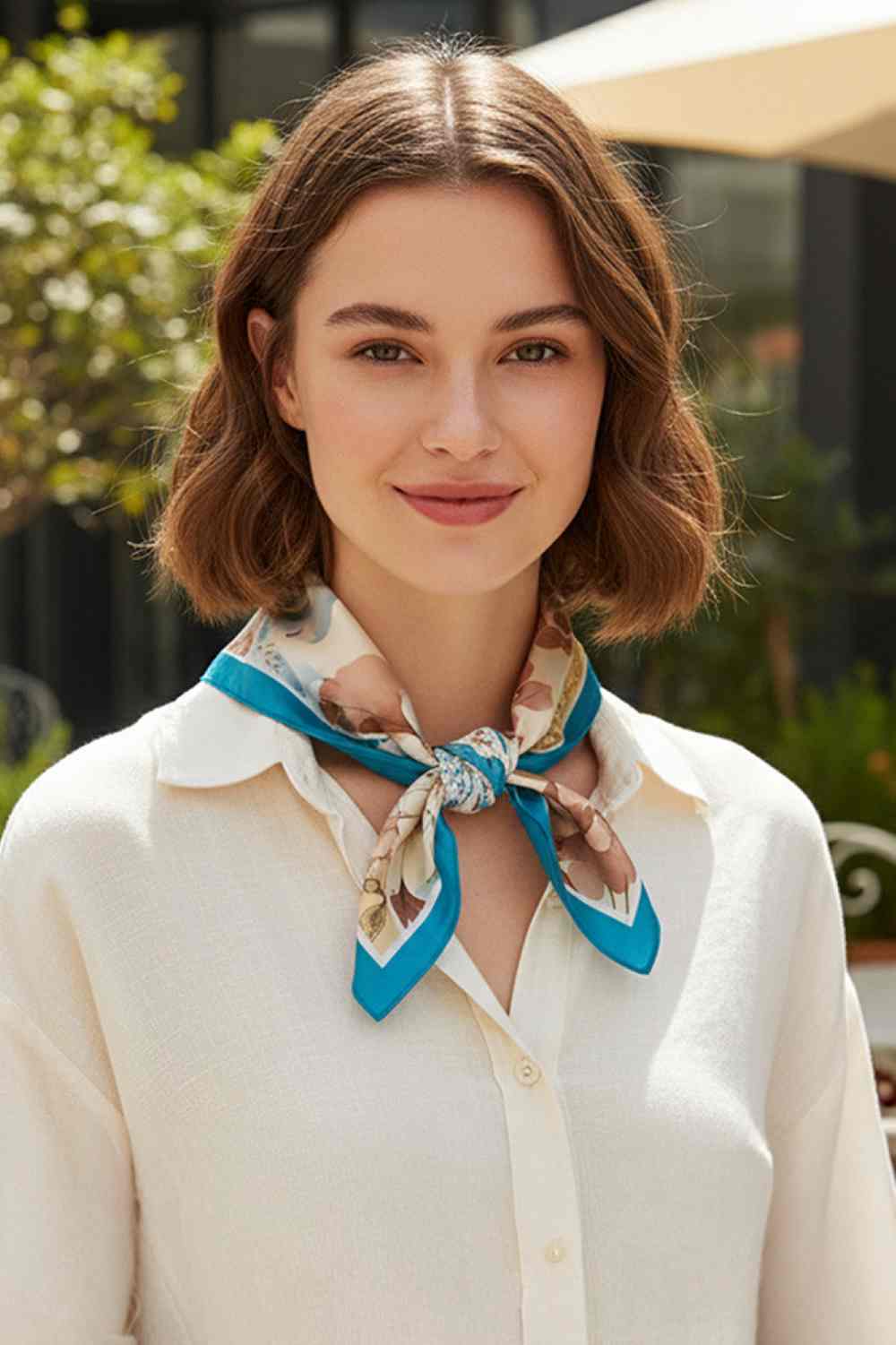 Teal Elevate your accessory game with this versatile bandana scarf featuring a vibrant multi-floral pattern. Crafted from 100% lightweight polyester with a silky finish, it drapes beautifully and feels luxuriously soft against your skin. The generous 27.5" x 27.5" square size offers endless styling possibilities wear it as a headscarf, neck wrap, or tie it to your bag for a pop of color. Perfect for all seasons, this easy-care piece transitions seamlessly from casual to chic. Whether you're protecting yours
