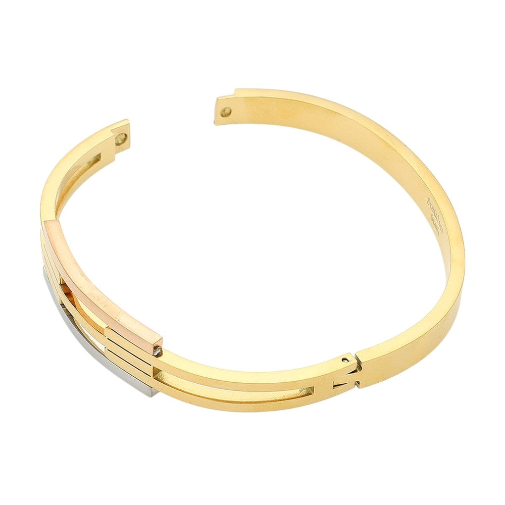 Three Tone Stainless steel three-tone hinged bangle bracelet is expertly crafted for a durable and stylish accessory. With its sturdy construction and three complementary tones, this bracelet is designed to add a touch of sophistication to any outfit. The hinged design allows for easy wear and removal, making it a convenient and versatile accessory.
