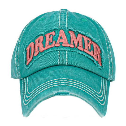 Turquoise Dreamer Message Vintage Baseball Cap, is crafted from durable cotton twill. It features an adjustable strap with an antique brass buckle for a snug fit and a unique vintage look. The bold printed message displays the wearer's commitment to their dream. Get the perfect fit and stylish look with this one-of-a-kind cap.