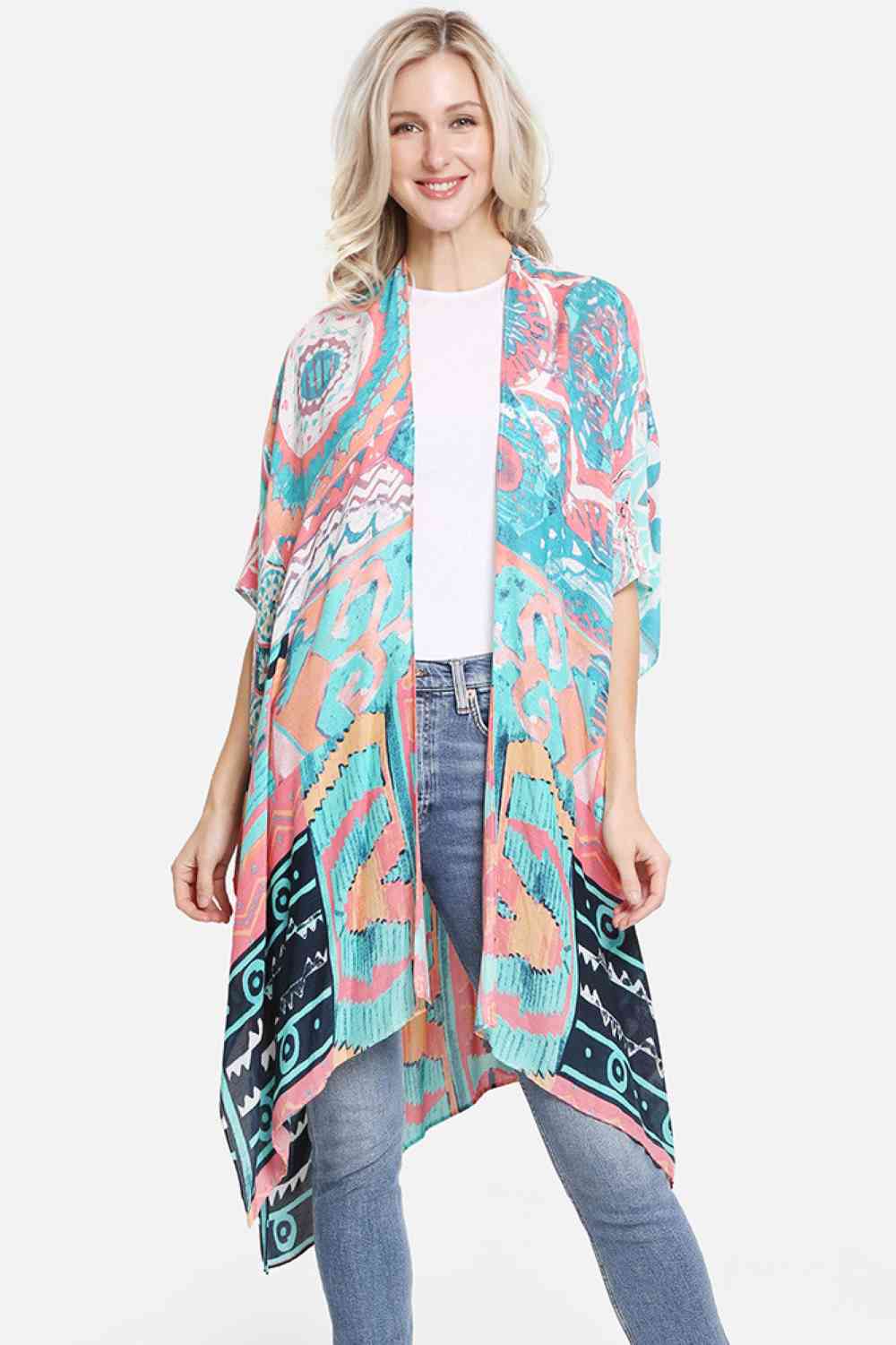 Turquoise Effortless elegance meets artistic flair with this abstract pattern print kimono. Crafted from 100% viscose, the fabric drapes beautifully while maintaining a soft, breathable feel perfect for layering or wearing solo. The generous 38" x 39" dimensions offer comfortable coverage and movement. Whether you're heading to the beach, brunch, or casual evening out, this versatile cover-up transitions seamlessly from day to night. A timeless piece that adds visual interest to any wardrobe.