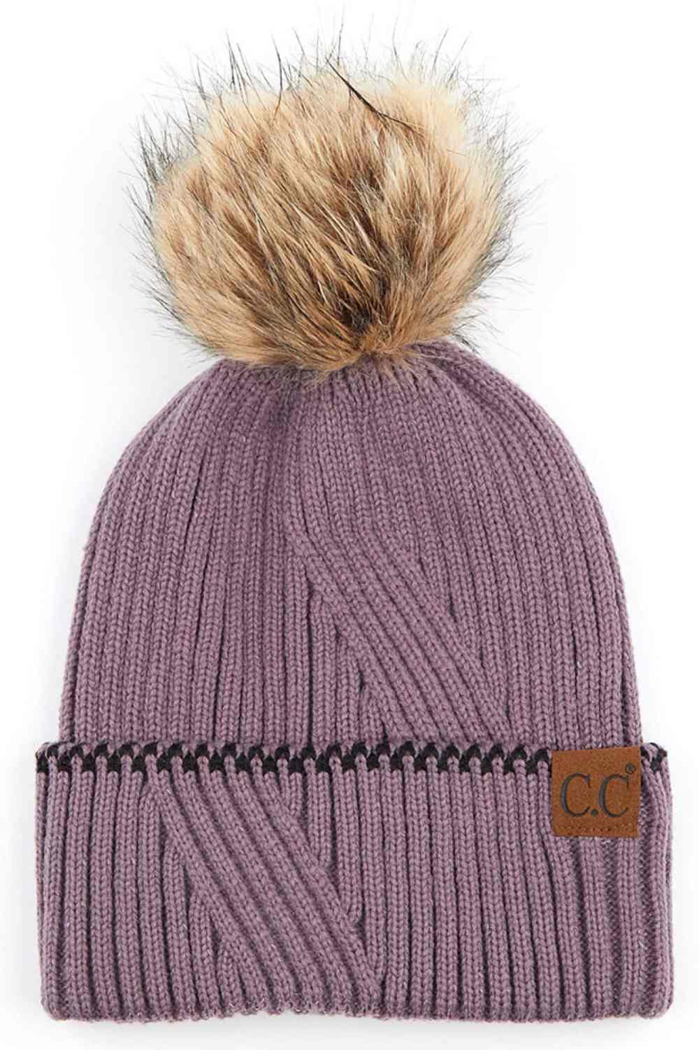 Violet C.C Solid Pom Beanie with Accented Cuff Stay warm and stylish with this classic C.C solid pom beanie, designed for everyday comfort. Made from 100% acrylic, this lightweight knit offers softness and durability through winter seasons.
