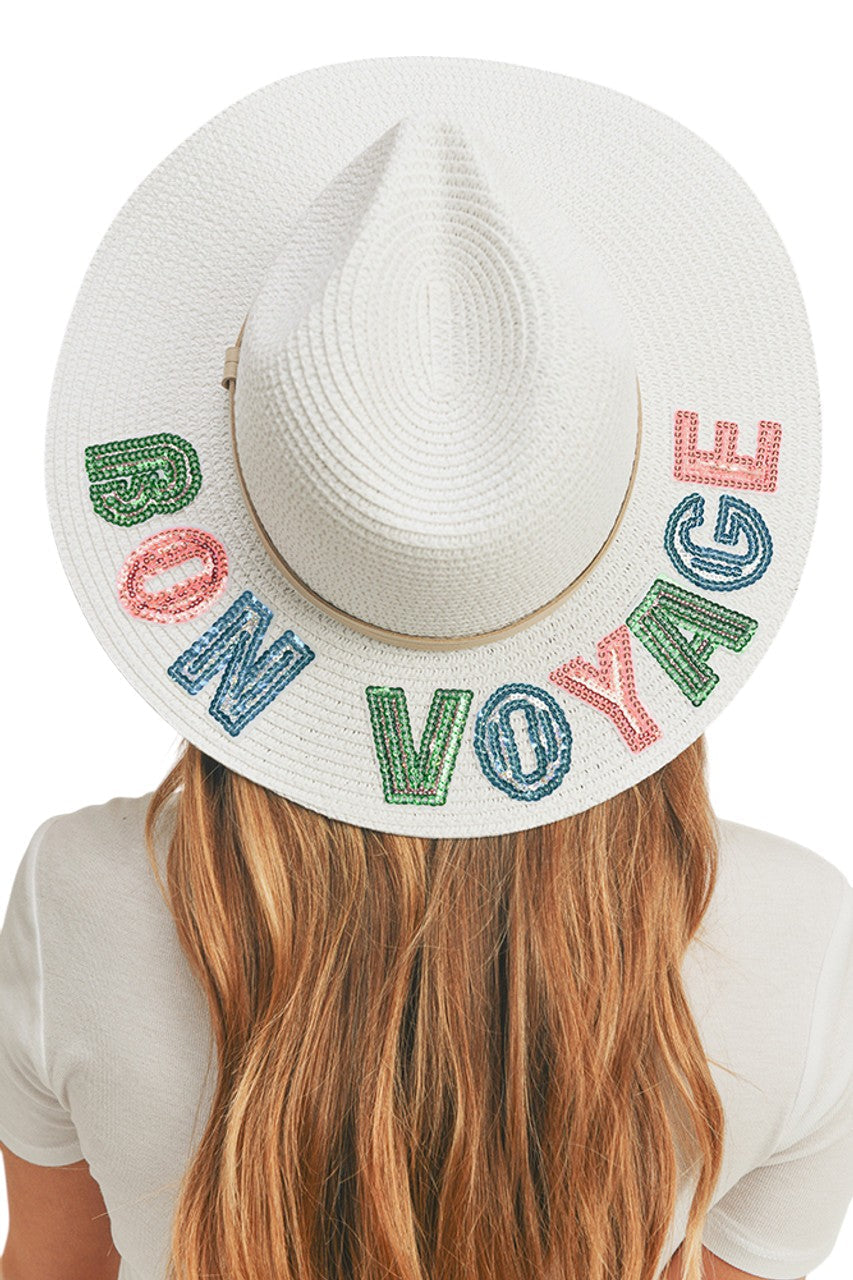 White BON VOYAGE Sequin Letter Panama Hat combines sophisticated sun protection with statement style. The premium straw construction features precision-applied sequin lettering that catches the light with every movement. Designed with a classic Panama silhouette and proper ventilation, it offers both UPF protection and breathability for extended outdoor wear. The structured brim maintains its shape while providing optimal face and neck coverage.