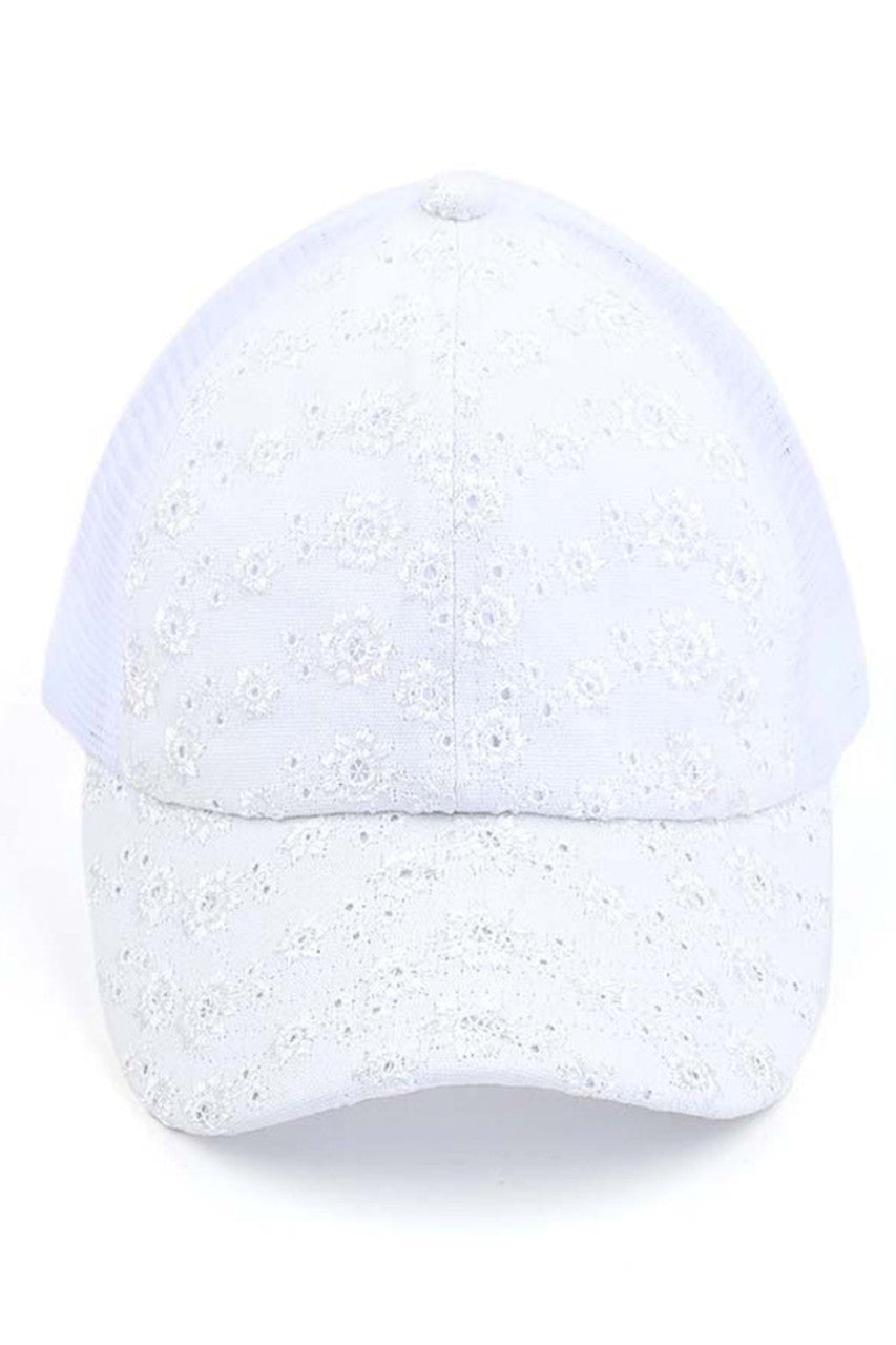 White C.C FLOWER EMBROIDERY EYELET CRISS CROSS PONYCAP features delicate flower embroidery and eyelet detailing, with a criss cross design for a chic and stylish look. Made with quality materials, this cap offers both fashion and functionality. Perfect for any casual or outdoor activity, it will keep you cool and covered.
