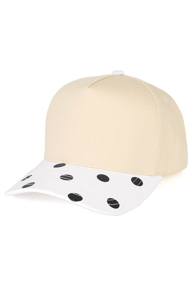 Classic style meets playful design with this C.C trucker hat. Bold big polka dots print the brim while two-tone construction adds visual interest and versatility. Structured mesh panels keep you cool and comfortable all day long, whether you're at the beach, running errands, or enjoying outdoor activities. The adjustable back strap ensures a secure, customizable fit for most head sizes. Fun, functional, and effortlessly stylish. Available Colors: Black, Brown, Navy, Red, White 100% Cotton Circumference: 22.