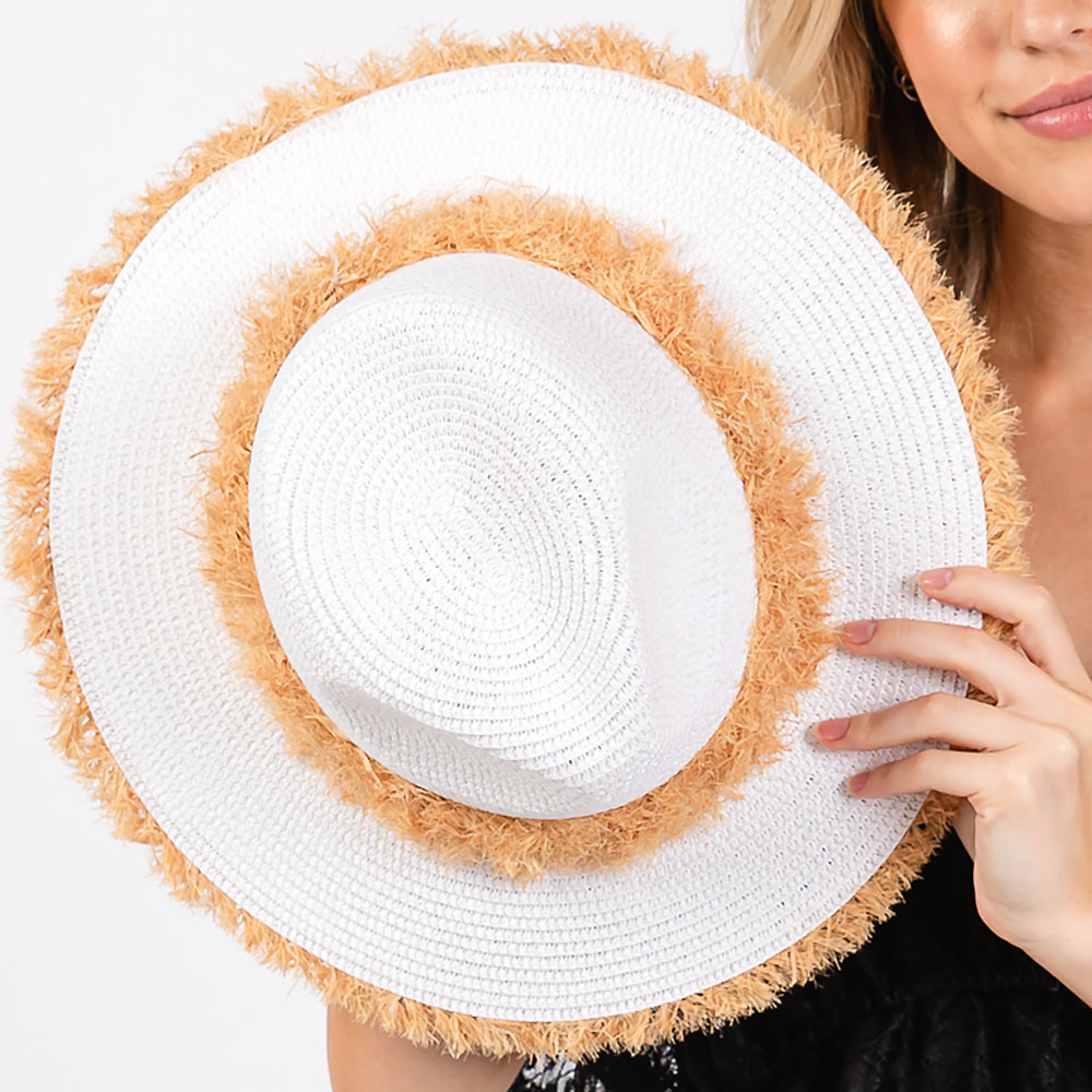 White Frayed Band and Trip Straw Sun Hat combines style and practicality. The frayed band adds a touch of texture, while the trip straw material provides superior sun protection. Perfect for a day at the beach or a stroll in the park, this hat will keep you both fashionable and protected.