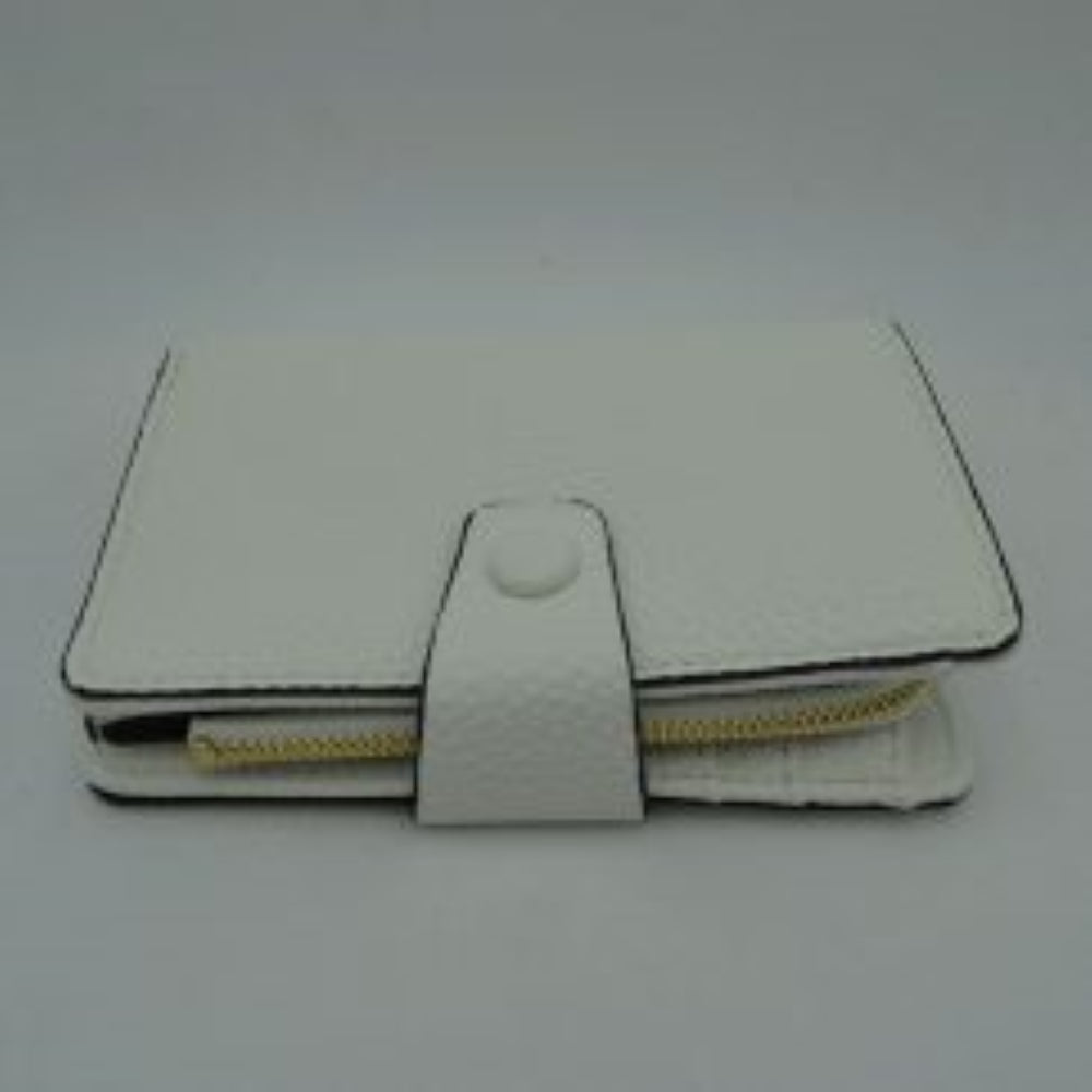 White This compact everyday wallet features a distinct pebbled texture and neat border stitching for a clean, structured appearance. Designed for efficient organization, the multi-compartment layout includes an accessible side storage compartment with a metallic zipper alongside a fold-over section secured by a central strap and snap-button closure. Its streamlined profile easily slips into larger bags or can be carried independently
